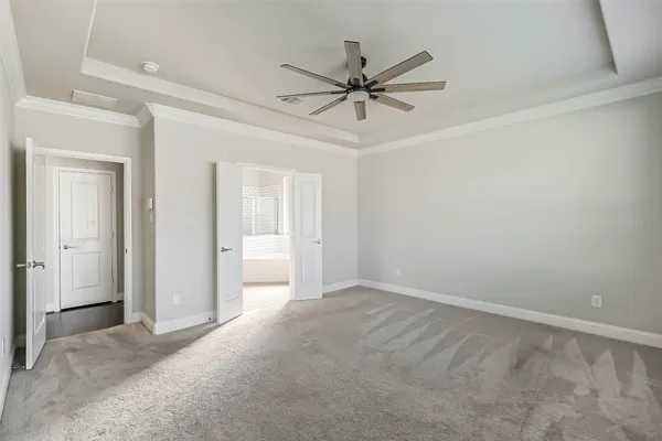 a view of a room with a fan and a window