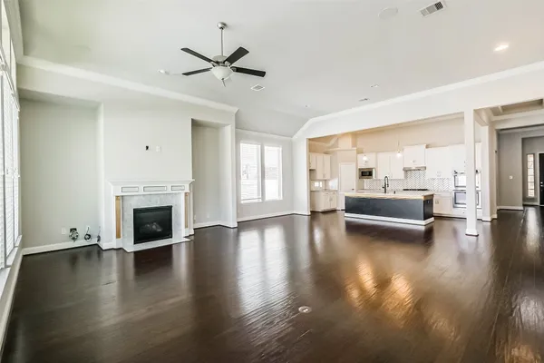 a view of a livingroom with furniture a fireplace