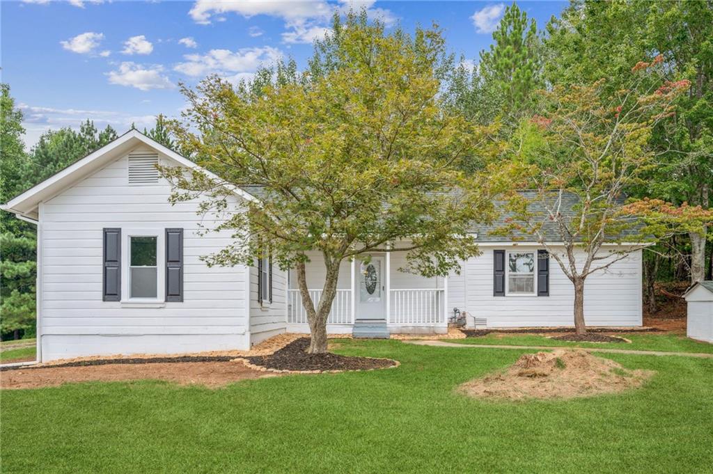 a front view of a house with a yard