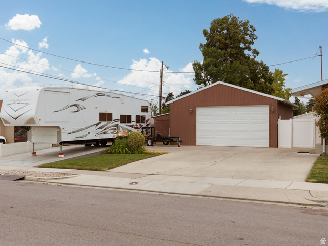 8252 Wood Street Midvale, UT 84047 - Photo 33 of 40 Spacious concrete driveway with an additional concrete pad for vehicle or RV parking