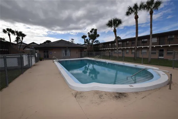 a view of a swimming pool with a terrace