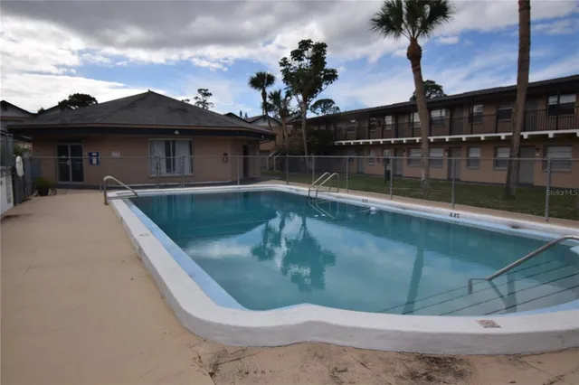 a view of a fountain in front of a house