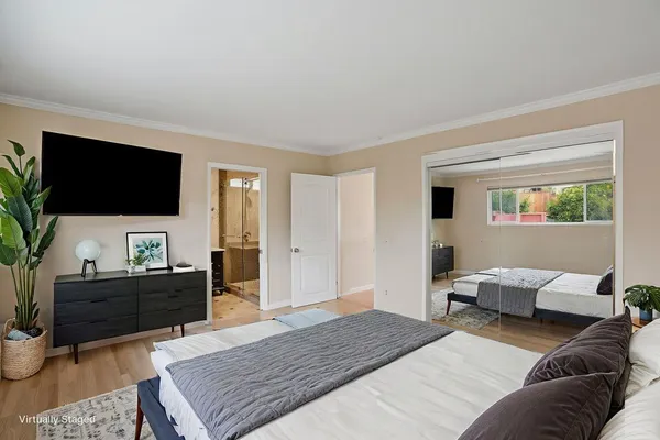 a bathroom with double vanity and a bathtub