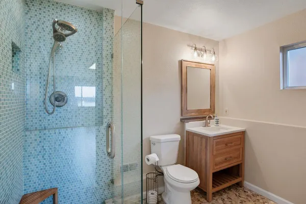 a bathroom with a sink a vanity and a mirror