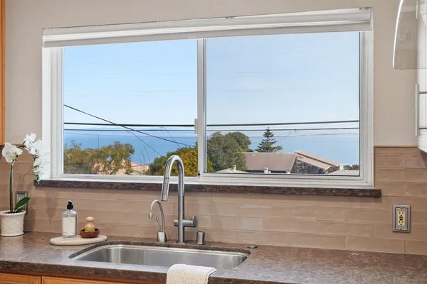 a kitchen with a stove and a refrigerator