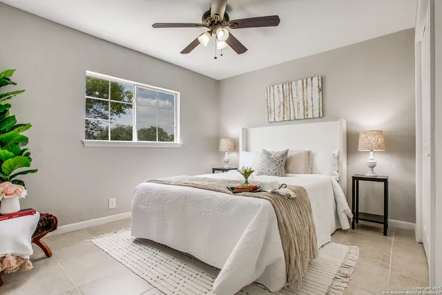 a bedroom with bed and a window