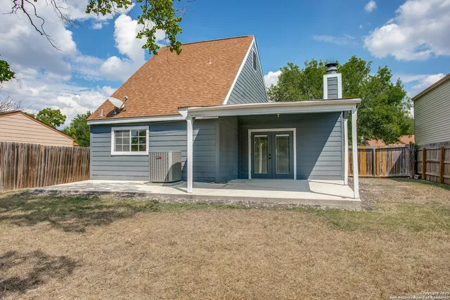 a house with trees in the background