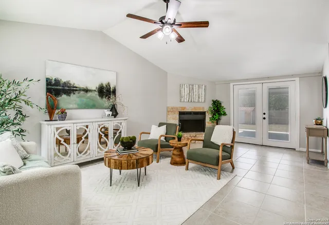 a living room with furniture and a fireplace