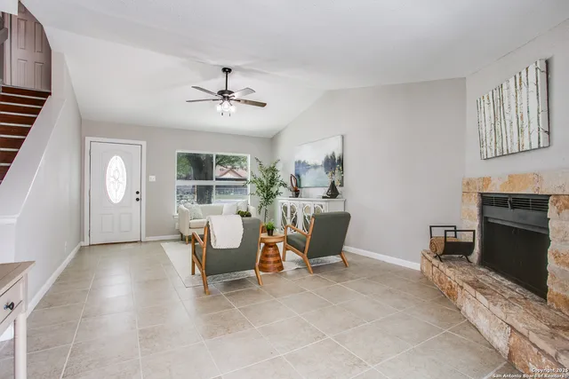 a view of a livingroom with furniture and a window