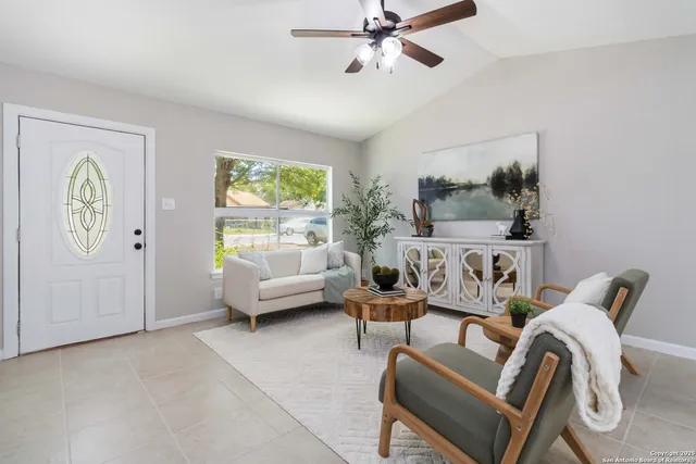 a living room with furniture and a window