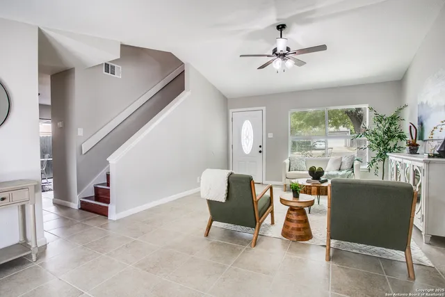 a living room with furniture and a window