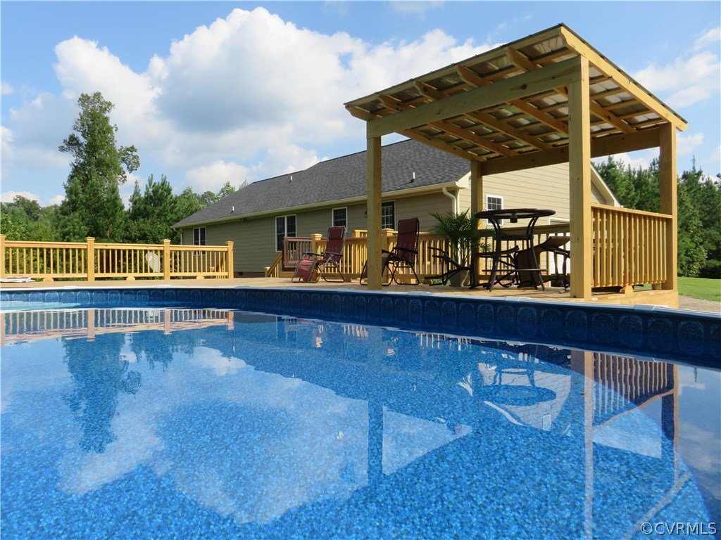 13730 Nash Road Dewitt, VA 23840 - Photo 7 of 29 a view of a chairs and table on the terrace