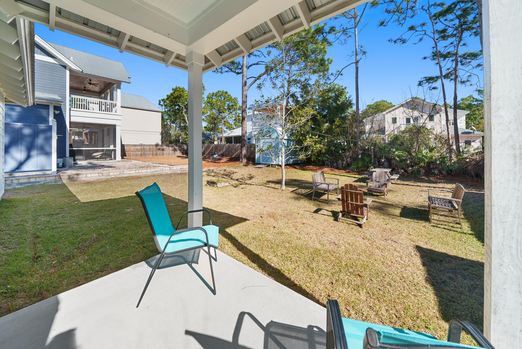 115 Barcelona Avenue Santa Rosa Beach, FL 32459 - Photo 19 of 34 a view of a backyard with plants and patio