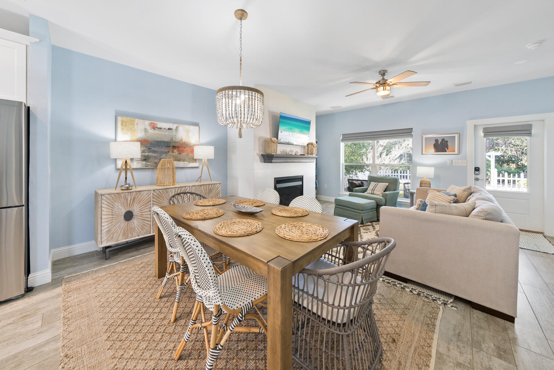 115 Barcelona Avenue Santa Rosa Beach, FL 32459 - Photo 3 of 34 a view of a dining room with furniture a chandelier and wooden floor