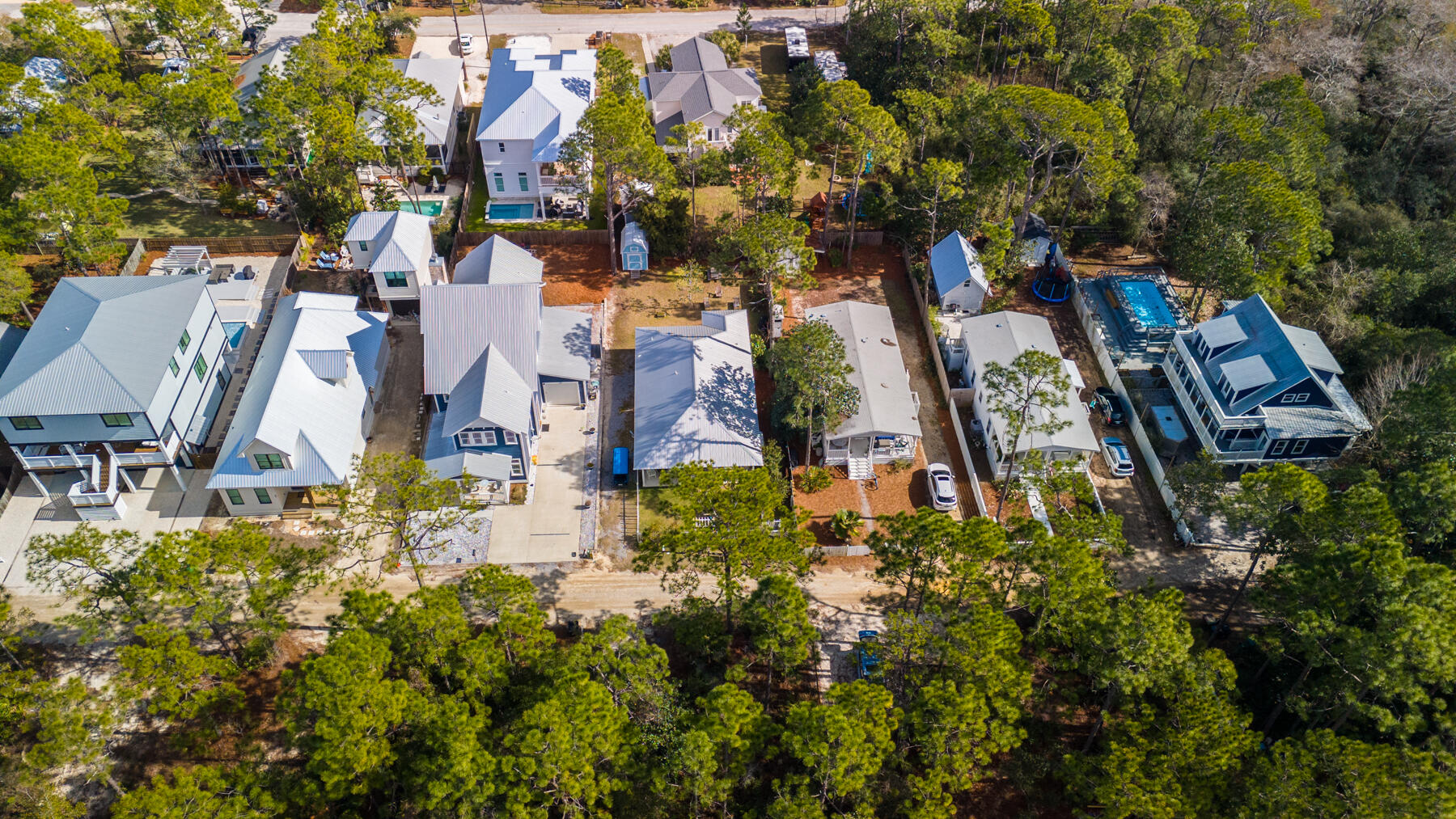 115 Barcelona Avenue Santa Rosa Beach, FL 32459 - Photo 33 of 34 an aerial view of residential house with outdoor space and trees all around