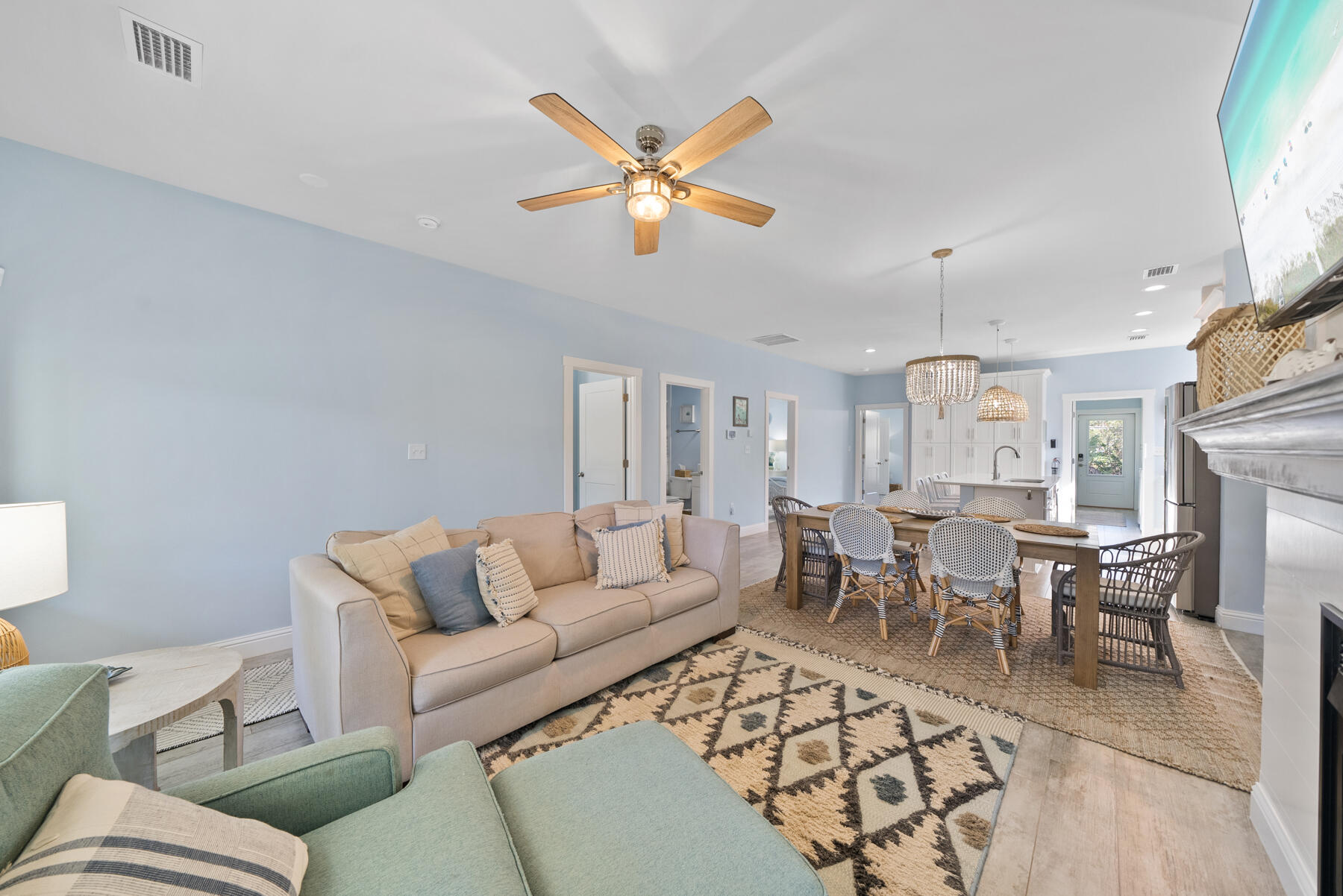 115 Barcelona Avenue Santa Rosa Beach, FL 32459 - Photo 4 of 34 a living room with furniture a chandelier and a rug