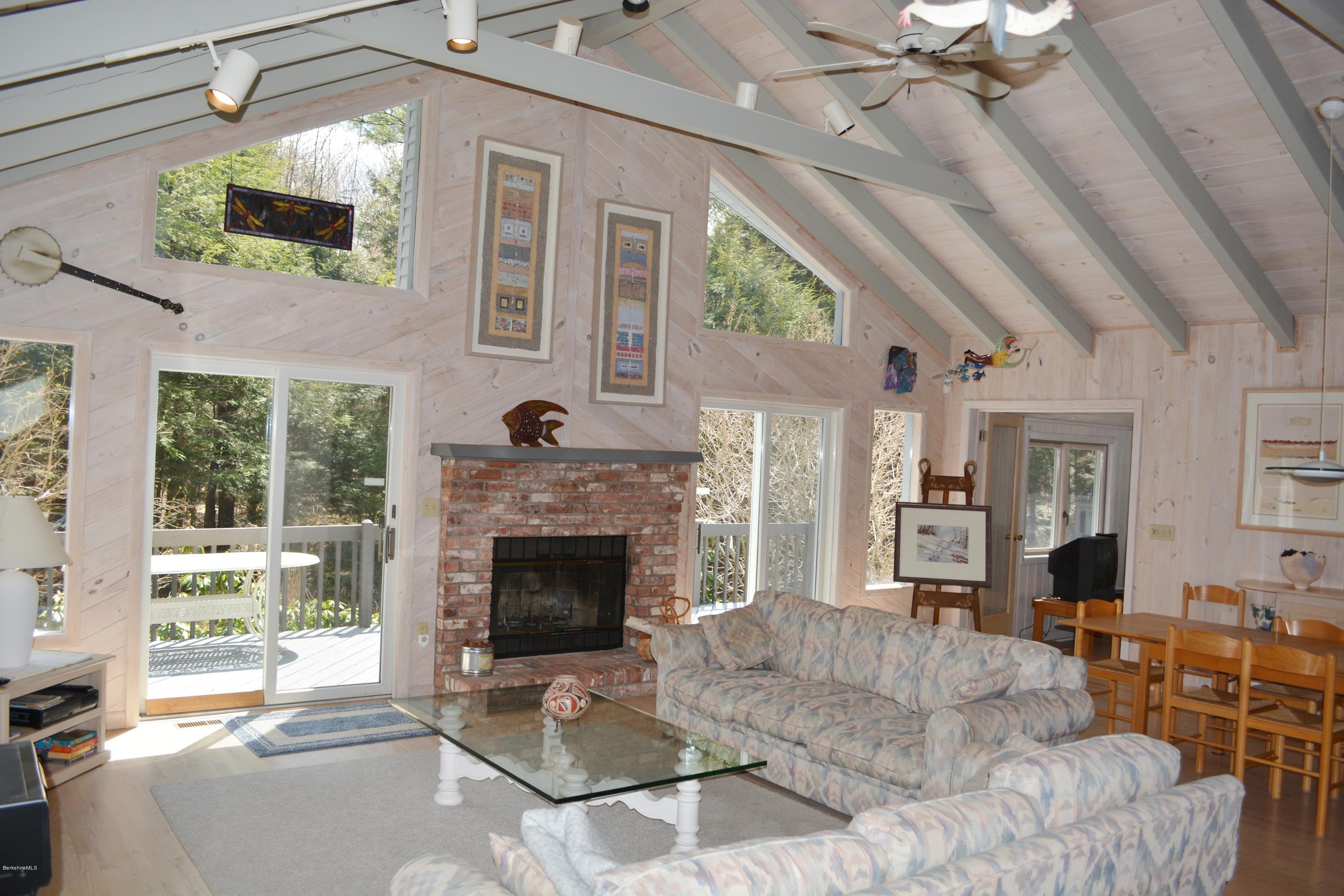 7 Sioux Road Becket, MA 01223 - Photo 2 of 22 a living room with furniture and a fireplace