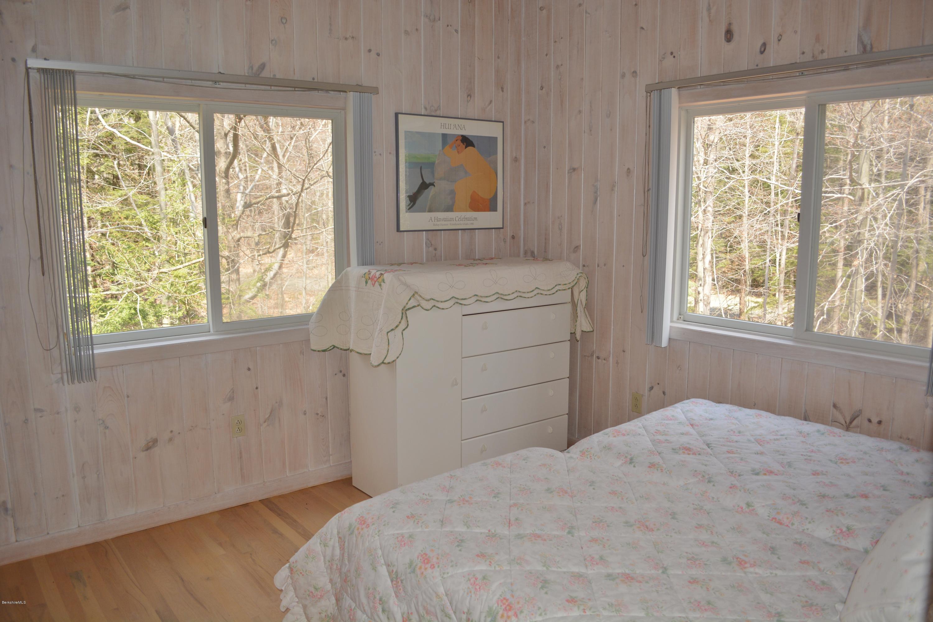 7 Sioux Road Becket, MA 01223 - Photo 11 of 22 a bedroom with a bed and a window