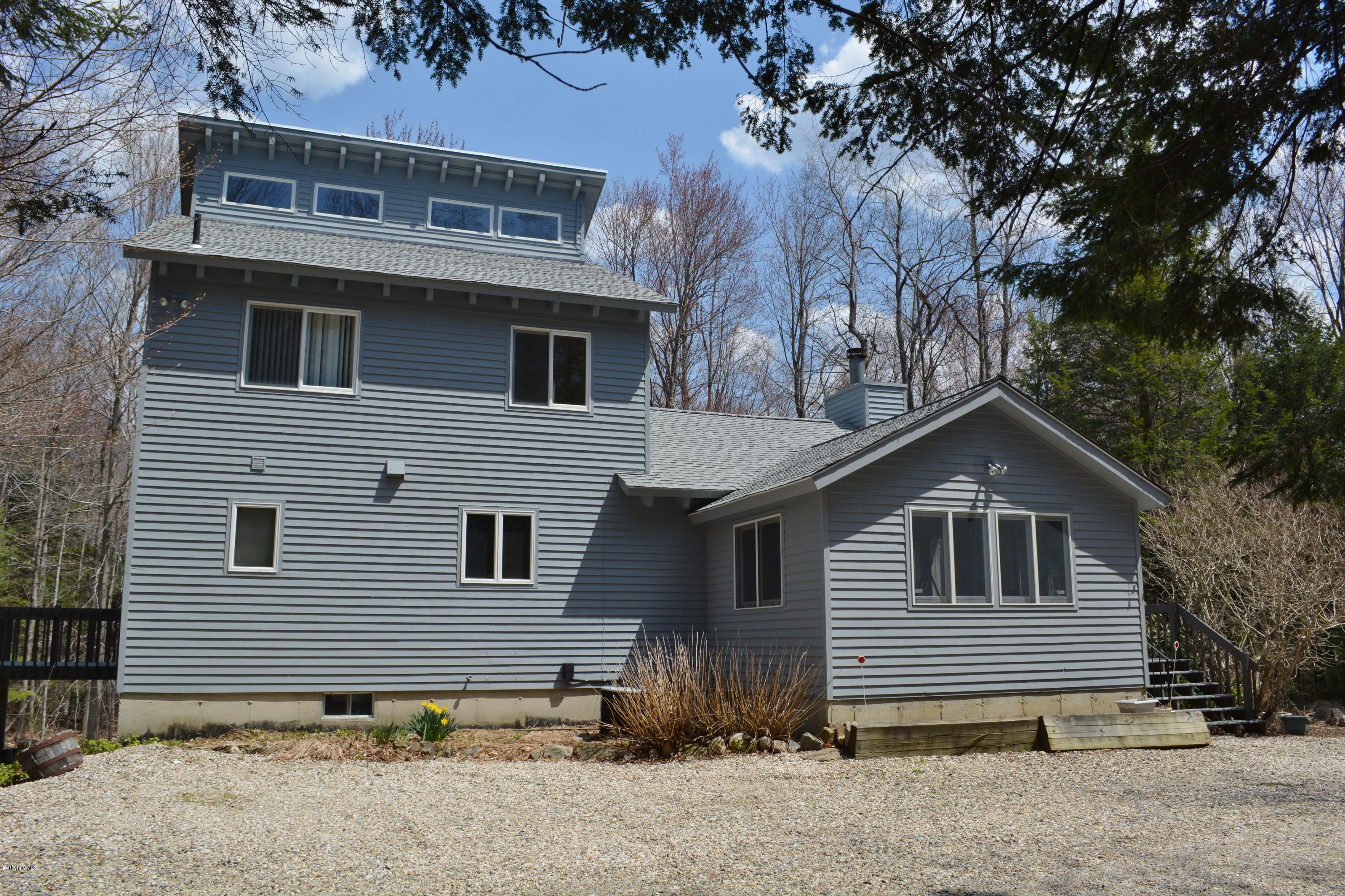 7 Sioux Road Becket, MA 01223 - Photo 14 of 22 a front view of a house with garden
