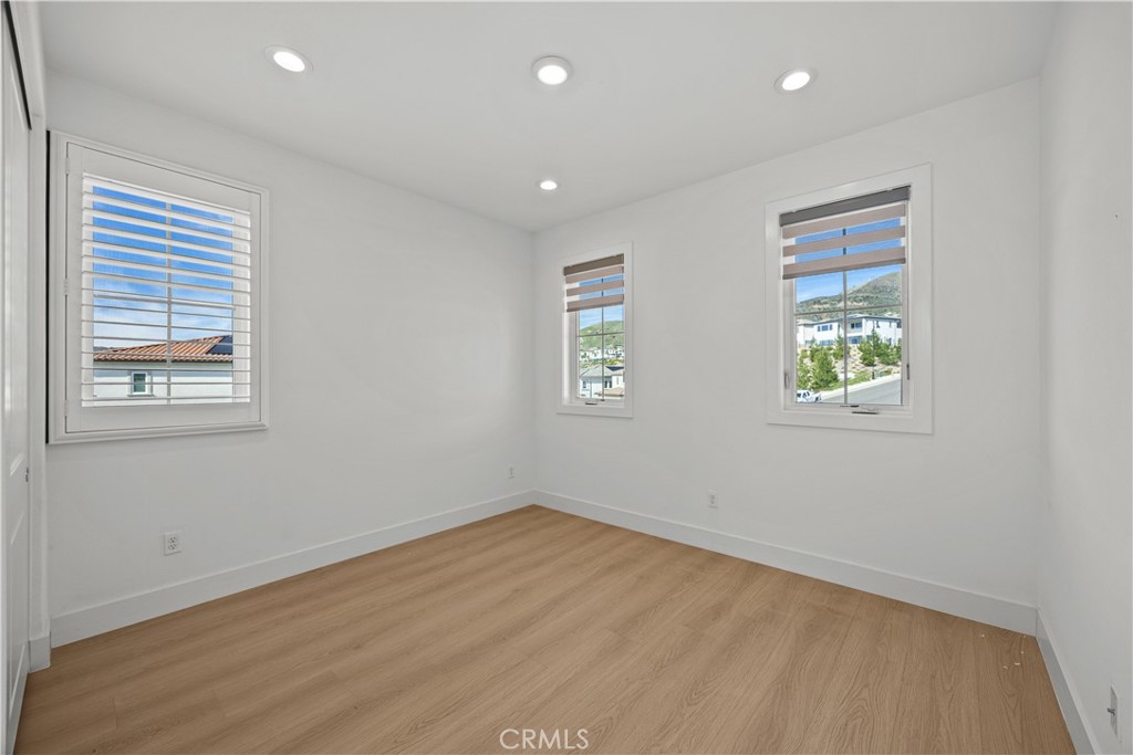 20638 Deer Grass Court Porter Ranch, CA 91326 - Photo 39 of 50 a view of empty room with windows