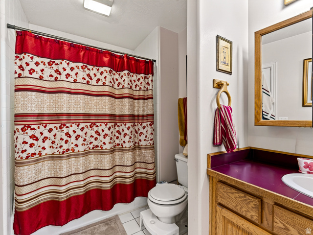4380 Main Street Logan, UT 84321 - Photo 32 of 74 2nd bathroom with wood-finish cabinetry, red countertop, and integrated sink