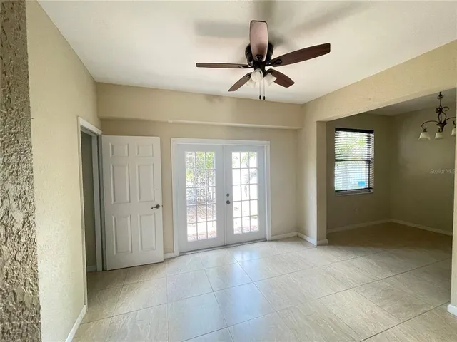 a view of an empty room with a window