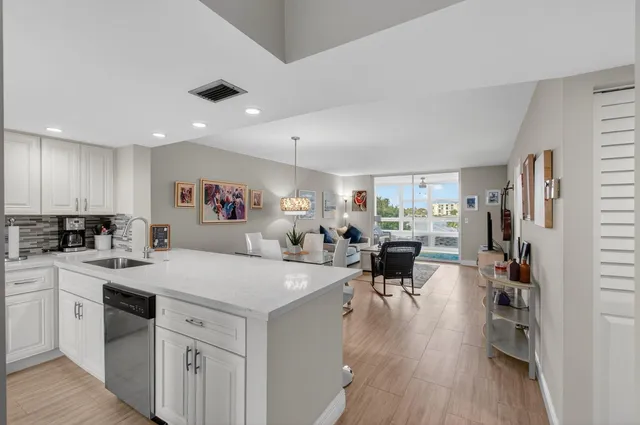 a view of a kitchen and dining room