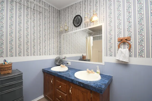 a bathroom with a sink and a mirror