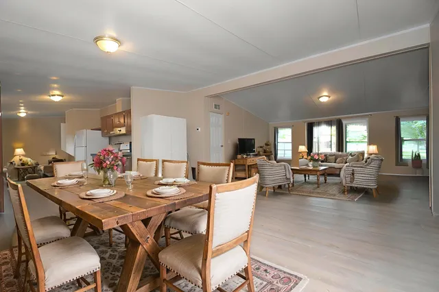 a view of a dining room with furniture and wooden floor