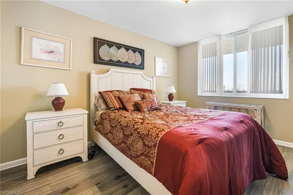 a bedroom with a bed and a cabinets