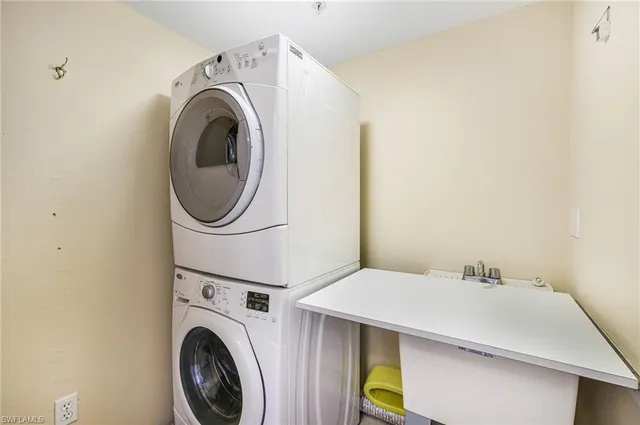 a view of a dining room with furniture and a window