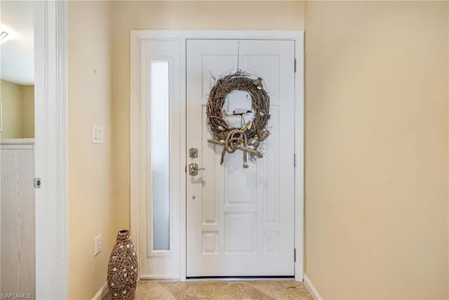 a living room with furniture a dining table and a fireplace