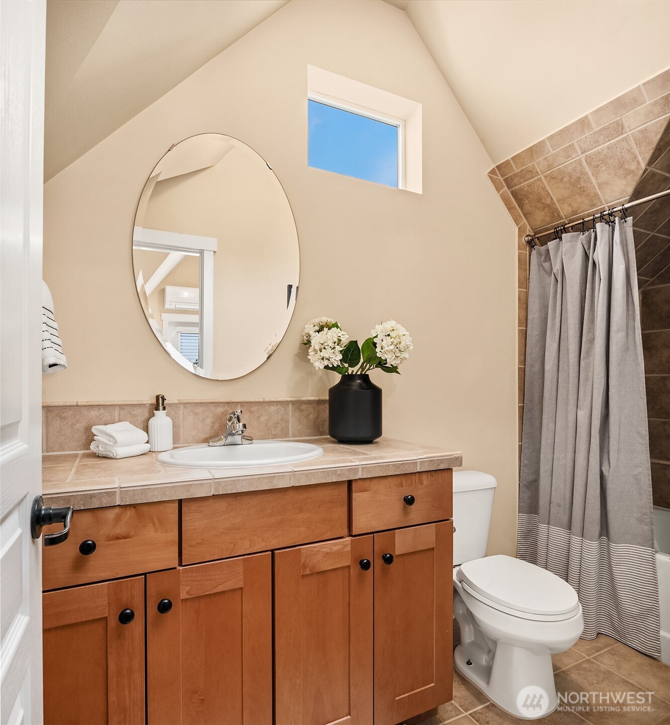 3615 Albion Place North, Unit B Seattle, WA 98103 - Photo 14 of 30 a bathroom with a toilet sink and mirror