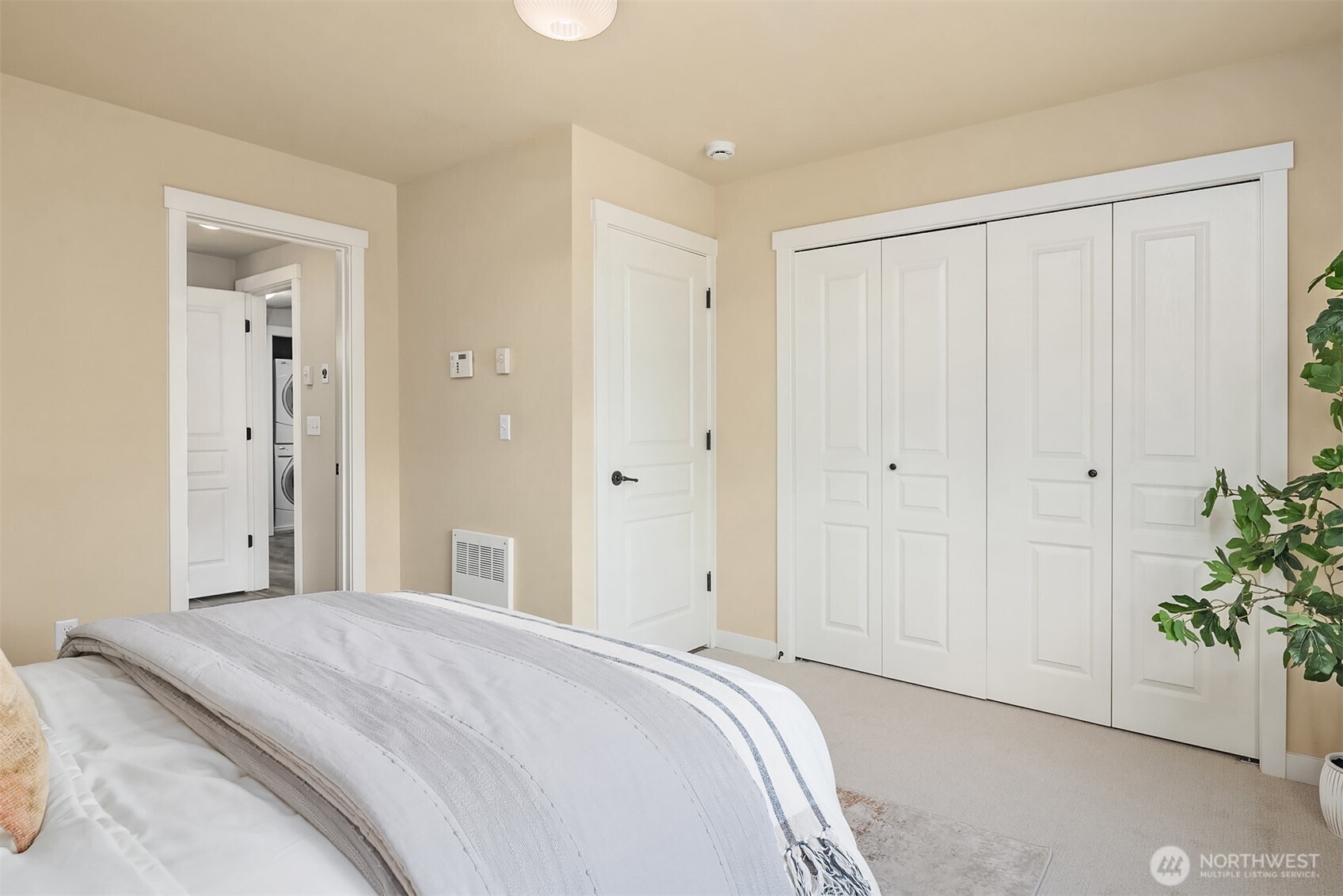 3615 Albion Place North, Unit B Seattle, WA 98103 - Photo 20 of 30 a bedroom with a bed and a painting