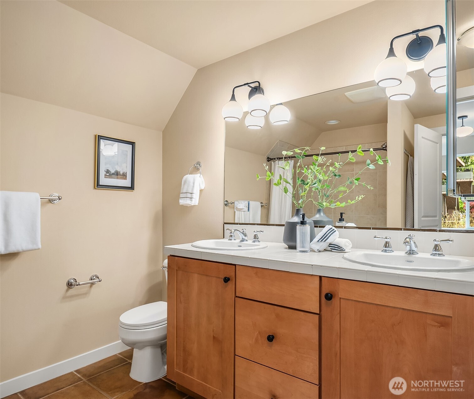 3615 Albion Place North, Unit B Seattle, WA 98103 - Photo 21 of 30 a bathroom with a granite countertop sink mirror vanity and toilet