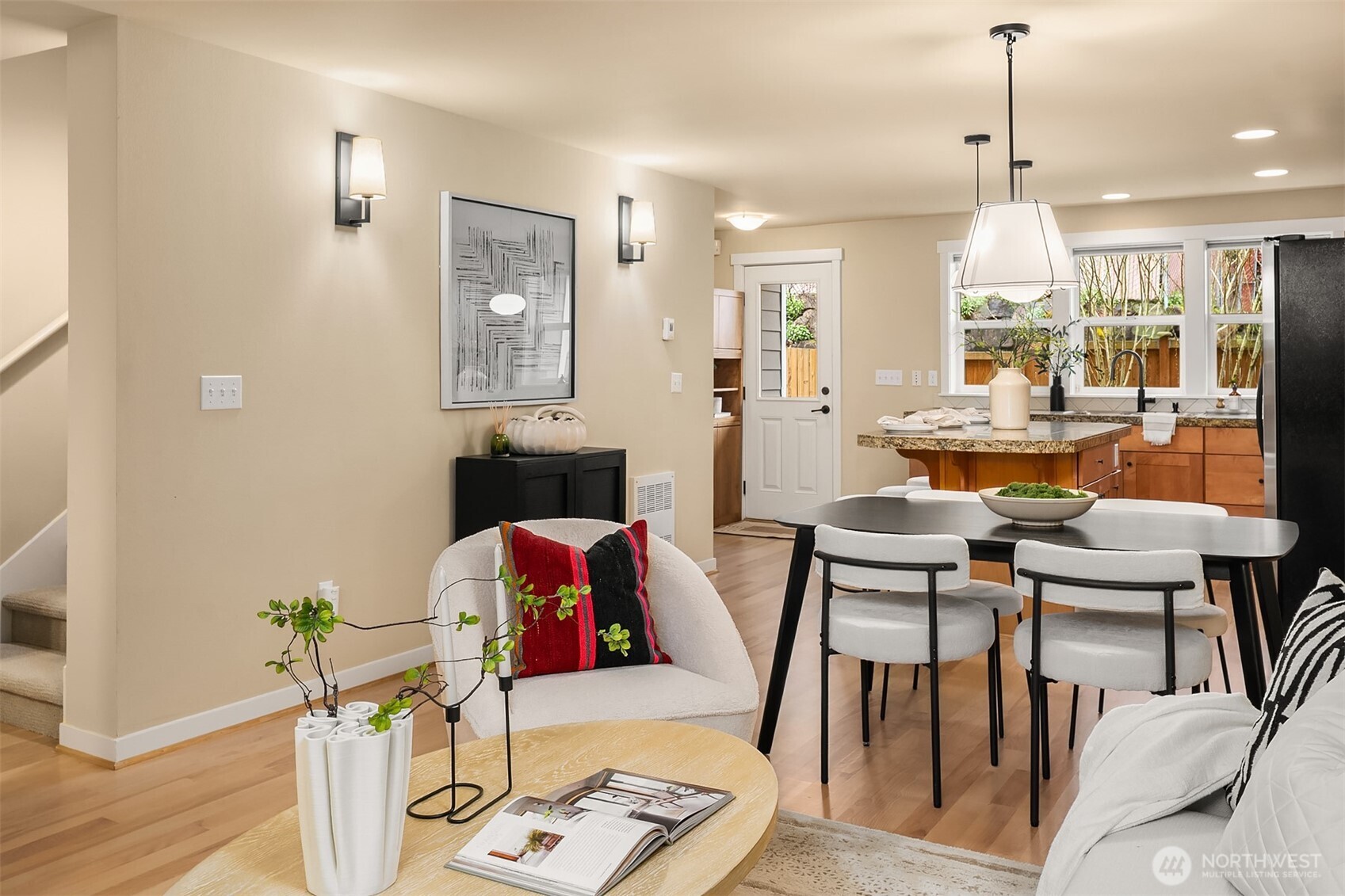 3615 Albion Place North, Unit B Seattle, WA 98103 - Photo 5 of 30 a living room with furniture and a chandelier