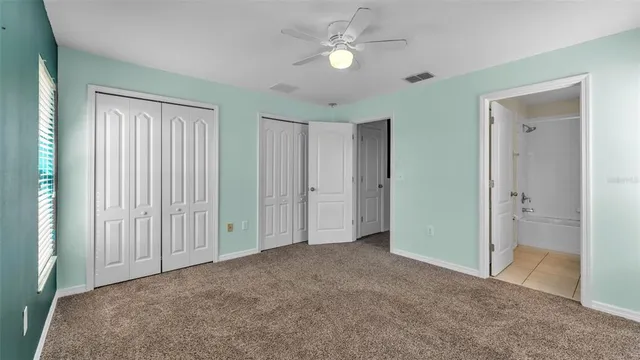 a view of empty room with fan