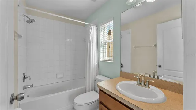 a bathroom with a sink shower bathtub and a toilet