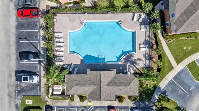 an aerial view of multiple houses with yard