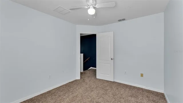 an empty room with closet area