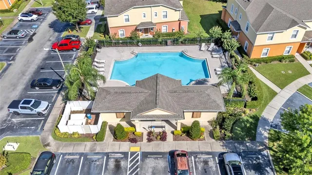 an aerial view of house with yard swimming pool and outdoor seating