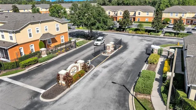 an aerial view of a house with outdoor space lake view