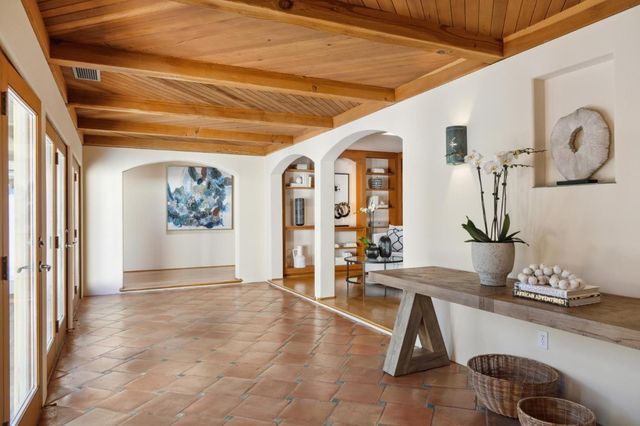 a room with gym equipment and view of living room