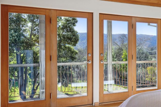 a view of a room that has a large window