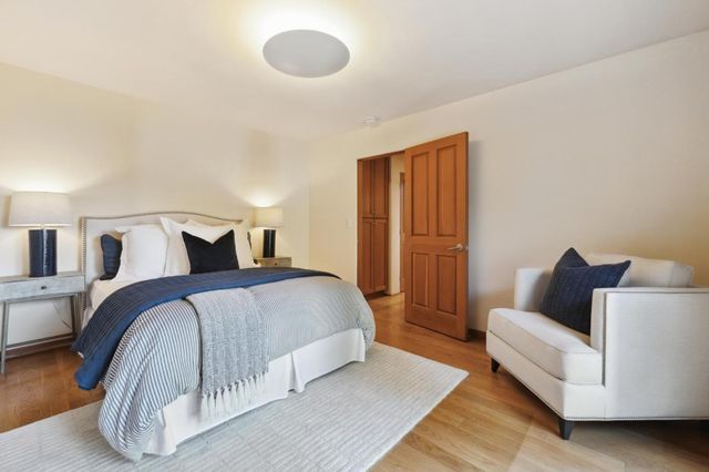 a bedroom with a bed and a couch