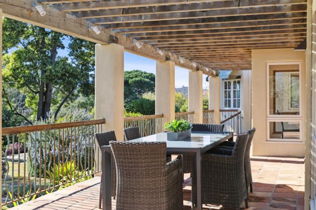 aerial view of a house with a big yard and potted plants