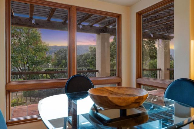 a view of a dining room with furniture window and outside view