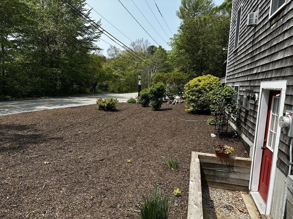 1 Park Road, Unit 1 Sandwich, MA 02644 - Photo 23 of 25 a view of backyard with seating space and trees