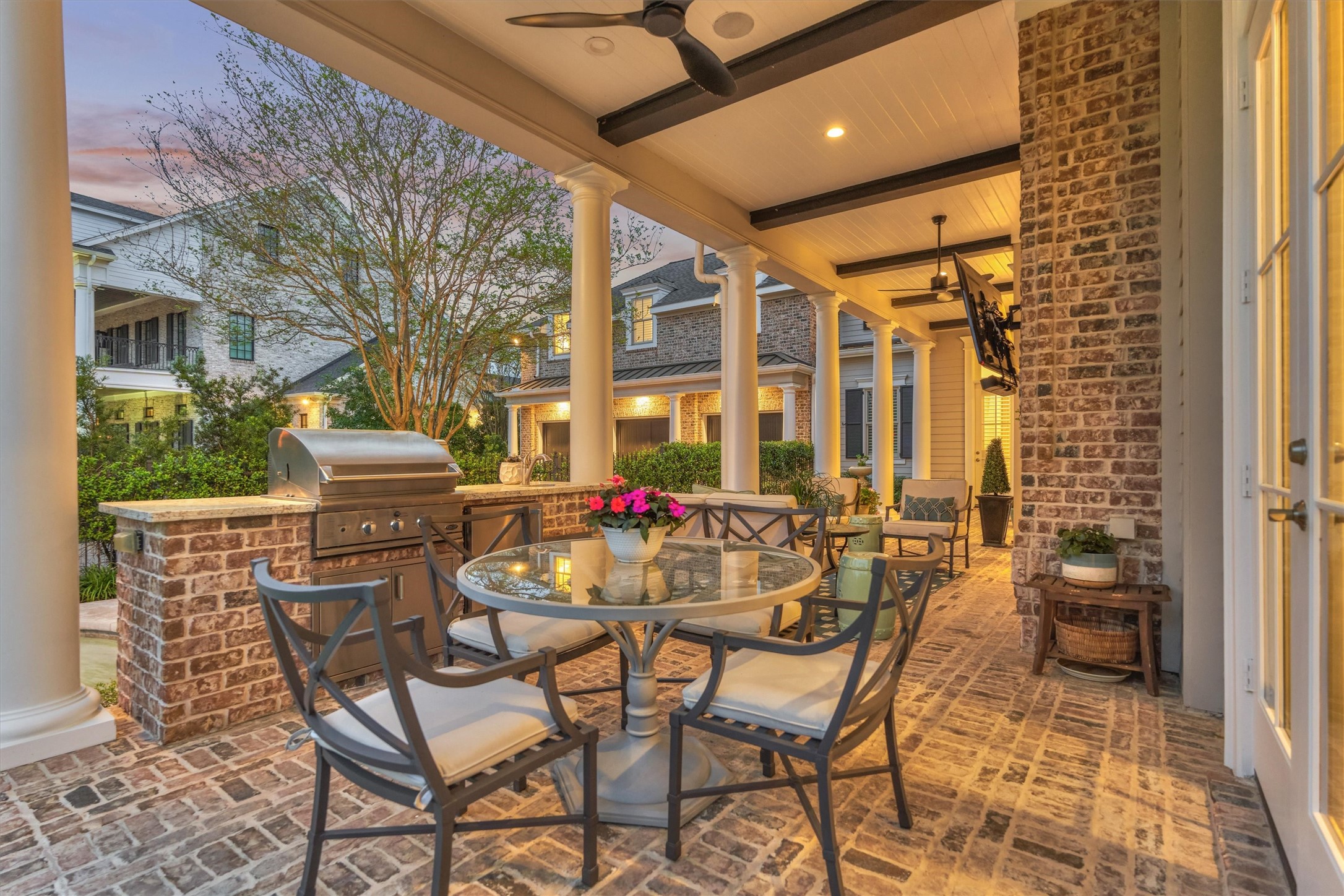 22 East Shore Drive The Woodlands, TX 77380 - Photo 46 of 50 The outdoor Kitchen and sitting area is covered and includes 270-degree water view, with plenty of room to entertain, a bulit-in summer kitchen with gas grill and sink.