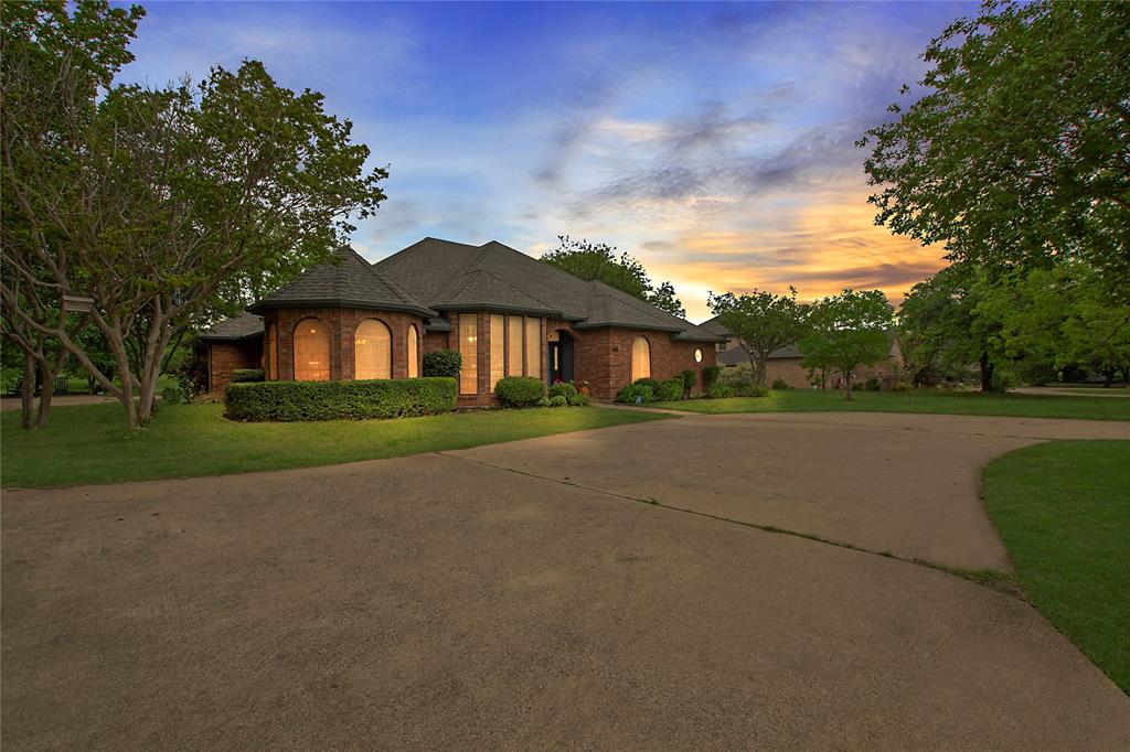1804 Crisp Road Ennis, TX 75119 - Photo 1 of 1 French country style house featuring concrete driveway, a yard, and brick siding